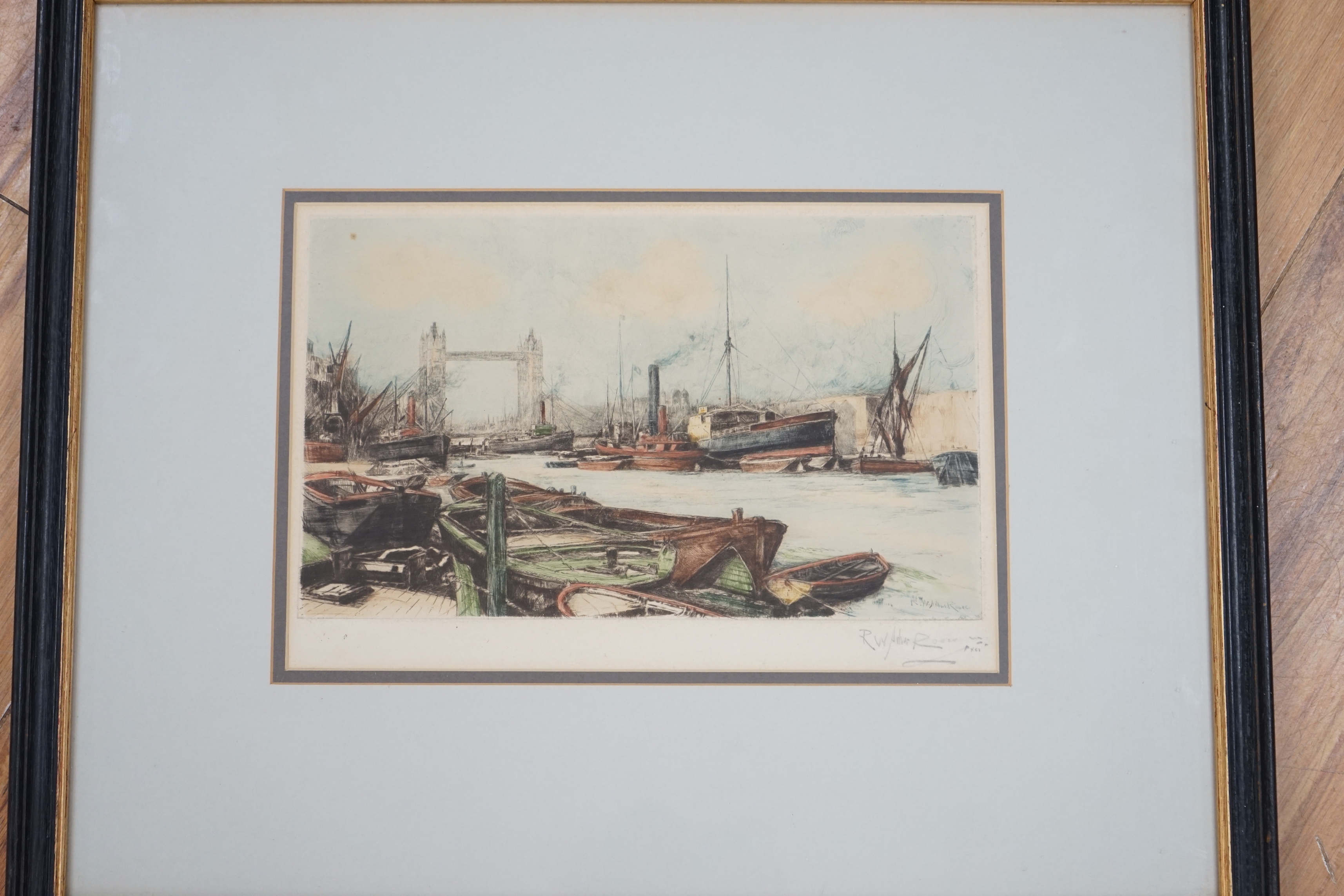 Harold Wyllie (1880-1973) etching, River boats and sailing ship, pencil signed and numbered XXI together with Robert William Arthur Rouse (1867-1951) colour etching, Tower Bridge, pencil signed, largest 16 x 31cm